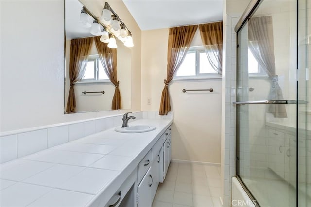 622 S Halcyon Rd, Arroyo Grande, CA 93420 - bathroom with vanity, bath / shower combo with glass door, and baseboards