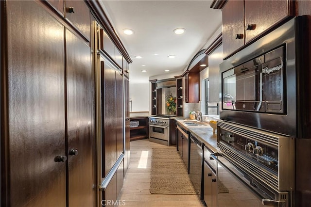 4286 W 182nd St Unit A, Torrance, CA 90504 - kitchen with stainless steel appliances, a sink, recessed lighting, light wood finished floors, and dark brown cabinetry