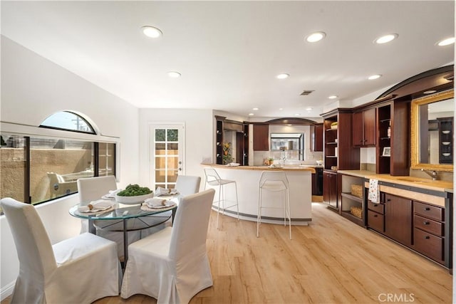 4286 W 182nd St Unit A, Torrance, CA 90504 - dining area featuring light wood finished floors, recessed lighting, and arched walkways