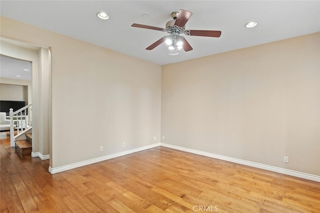 15561 Jasmine Pl, Tustin, CA 92782 - unfurnished room with light wood finished floors, baseboards, a ceiling fan, recessed lighting, and stairway