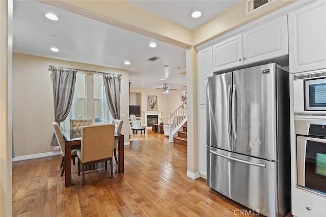 15561 Jasmine Pl, Tustin, CA 92782 - dining room with stairs, light wood-type flooring, baseboards, recessed lighting, and ceiling fan