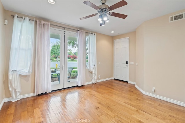 15561 Jasmine Pl, Tustin, CA 92782 - empty room with light wood-style floors, baseboards, french doors, a ceiling fan, and recessed lighting
