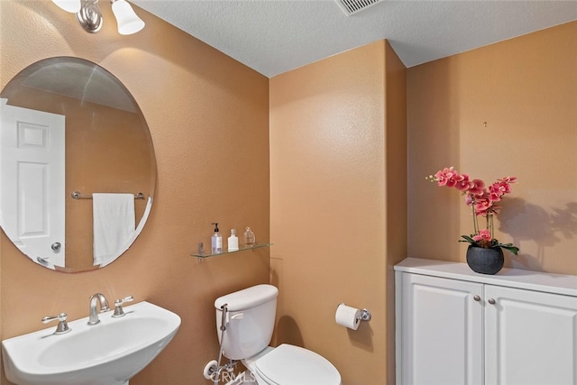 15561 Jasmine Pl, Tustin, CA 92782 - bathroom with a sink, toilet, and a textured ceiling