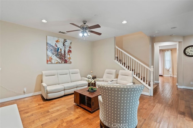 15561 Jasmine Pl, Tustin, CA 92782 - living area with baseboards, light wood finished floors, ceiling fan, recessed lighting, and stairs