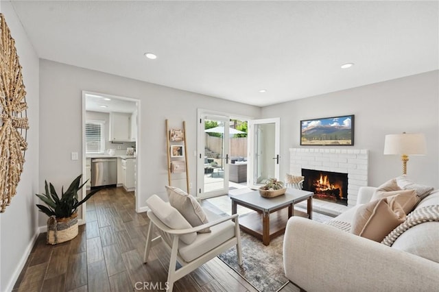 1530 N Grove St, Redlands, CA 92374 - living room featuring a brick fireplace, dark wood finished floors, baseboards, and recessed lighting