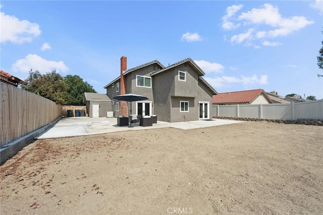 1530 N Grove St, Redlands, CA 92374 - back of house featuring a patio area, a chimney, stucco siding, french doors, and a fenced backyard