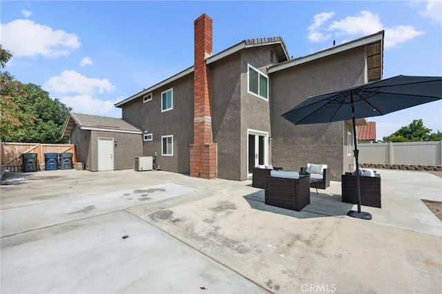 1530 N Grove St, Redlands, CA 92374 - back of house with stucco siding, outdoor lounge area, a patio area, french doors, and a chimney
