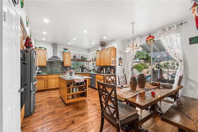 3410 Genoa Pl, Palmdale, CA 93551 - dining space with hardwood / wood-style floors, recessed lighting, and a chandelier