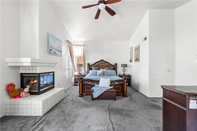 3410 Genoa Pl, Palmdale, CA 93551 - bedroom with carpet flooring, lofted ceiling, a tile fireplace, and baseboards