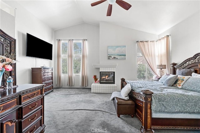 3410 Genoa Pl, Palmdale, CA 93551 - bedroom featuring lofted ceiling, carpet, a tile fireplace, and a ceiling fan