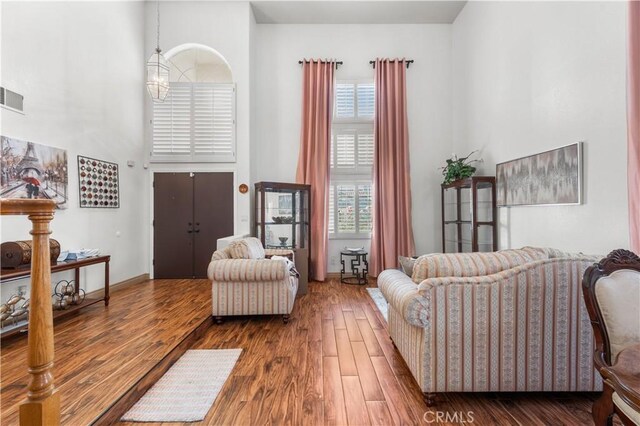 3410 Genoa Pl, Palmdale, CA 93551 - living area featuring a high ceiling and wood finished floors
