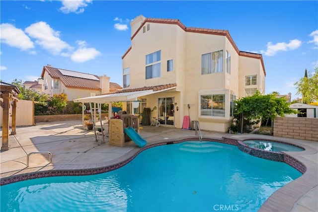 3410 Genoa Pl, Palmdale, CA 93551 - view of swimming pool featuring a patio area and a pool with connected hot tub