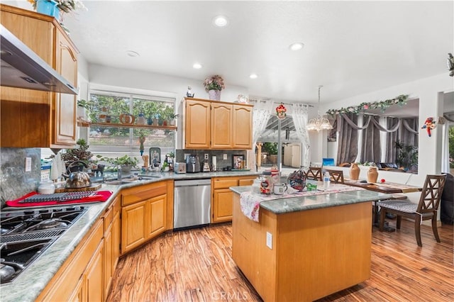 3410 Genoa Pl, Palmdale, CA 93551 - kitchen featuring dishwasher, black gas cooktop, range hood, light wood-style flooring, and backsplash