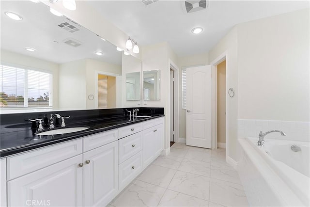 20304 Estuary Ln, Newport Beach, CA 92660 - full bath featuring marble look tiles, a bath, double vanity, recessed lighting, and baseboards