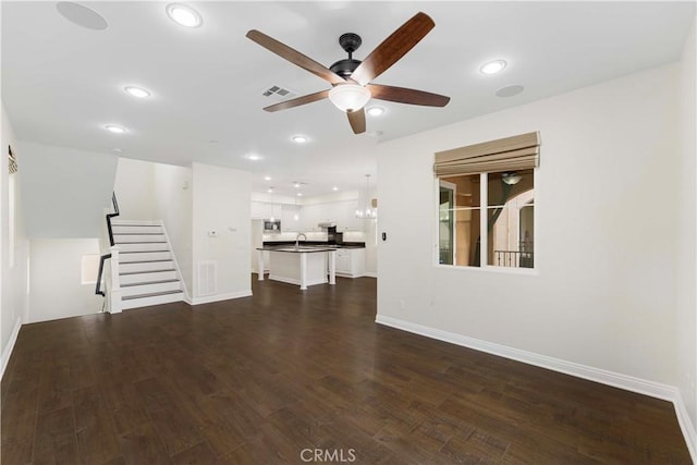 20304 Estuary Ln, Newport Beach, CA 92660 - unfurnished living room featuring a ceiling fan, stairway, a sink, dark wood-style flooring, and recessed lighting