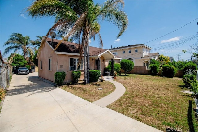 view of front of house featuring driveway and stucco siding