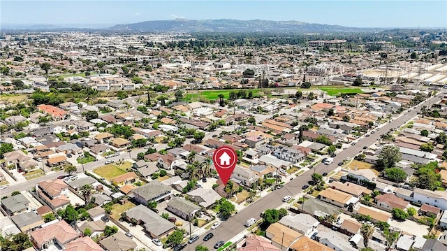 aerial view of property's location featuring a mountainous background
