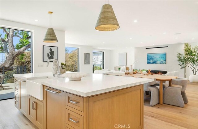 1759 Glenneyre St, Laguna Beach, CA 92651 - kitchen with a sink, open floor plan, light wood-type flooring, recessed lighting, and hanging light fixtures
