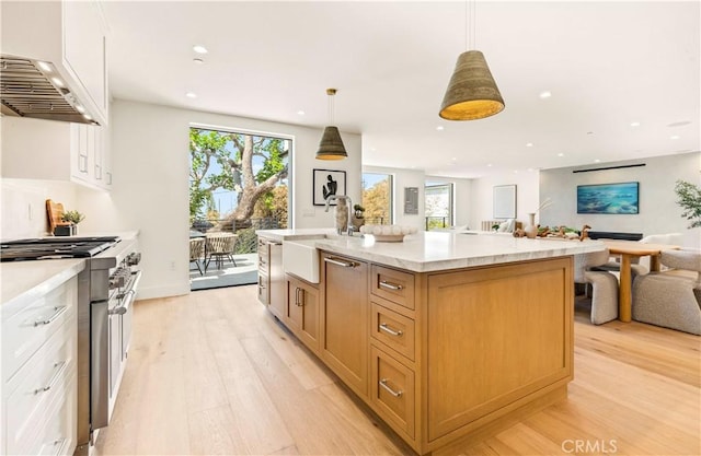 1759 Glenneyre St, Laguna Beach, CA 92651 - kitchen with double oven range, a sink, light wood finished floors, open floor plan, and recessed lighting
