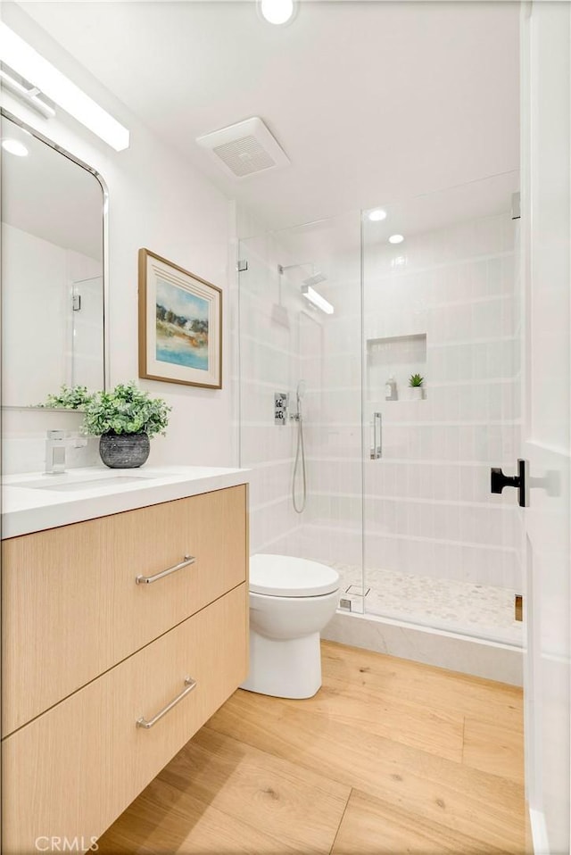 1759 Glenneyre St, Laguna Beach, CA 92651 - full bathroom with toilet, a stall shower, vanity, and wood finished floors