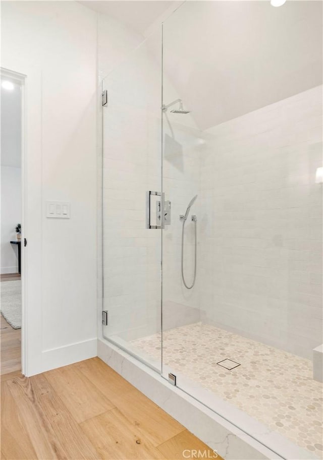 1759 Glenneyre St, Laguna Beach, CA 92651 - bathroom with a shower stall, wood finished floors, and baseboards