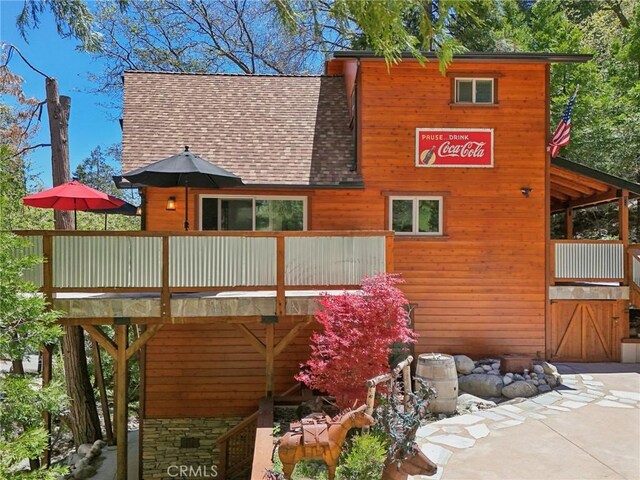 385 Iris Dr, Twin Peaks, CA 92391 - rear view of house featuring roof with shingles and a wooden deck