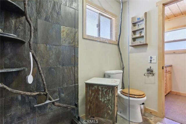 385 Iris Dr, Twin Peaks, CA 92391 - bathroom featuring walk in shower, toilet, and baseboards