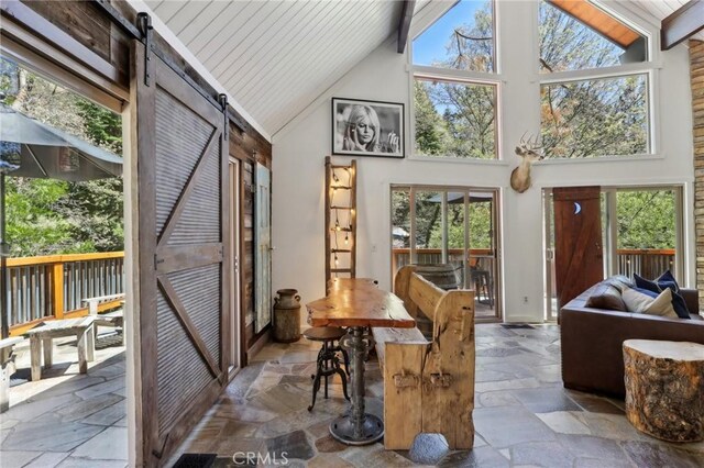 385 Iris Dr, Twin Peaks, CA 92391 - sunroom / solarium with vaulted ceiling, a barn door, and plenty of natural light