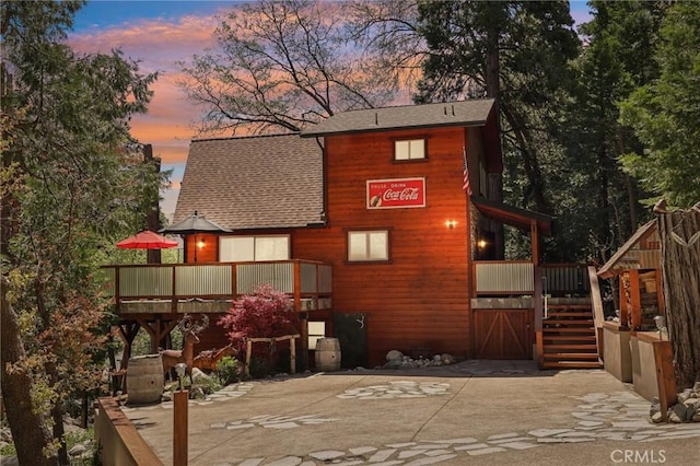 385 Iris Dr, Twin Peaks, CA 92391 - rear view of property with stairs, a shingled roof, and a wooden deck