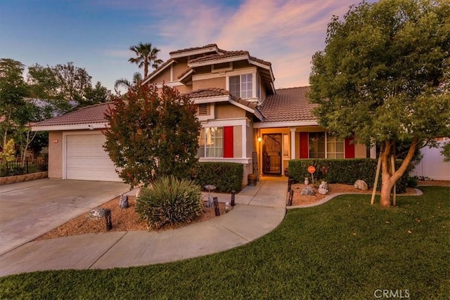 12427 Stardell Ln, Yucaipa, CA 92399 - view of front facade featuring a tile roof, driveway, stucco siding, and a front lawn