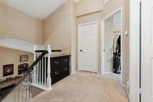 12427 Stardell Ln, Yucaipa, CA 92399 - corridor featuring an upstairs landing, carpet, and baseboards