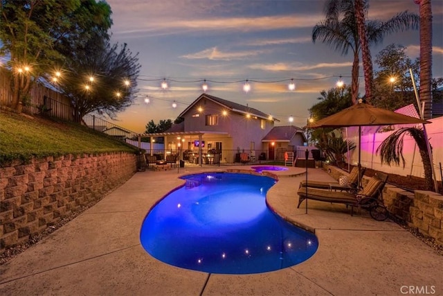 12427 Stardell Ln, Yucaipa, CA 92399 - view of swimming pool featuring a patio, a pool with connected hot tub, and a fenced backyard