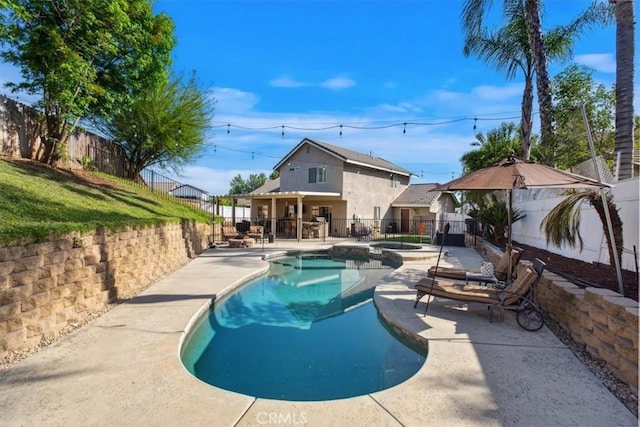 12427 Stardell Ln, Yucaipa, CA 92399 - view of pool with a fenced backyard, a patio area, and a pool with connected hot tub