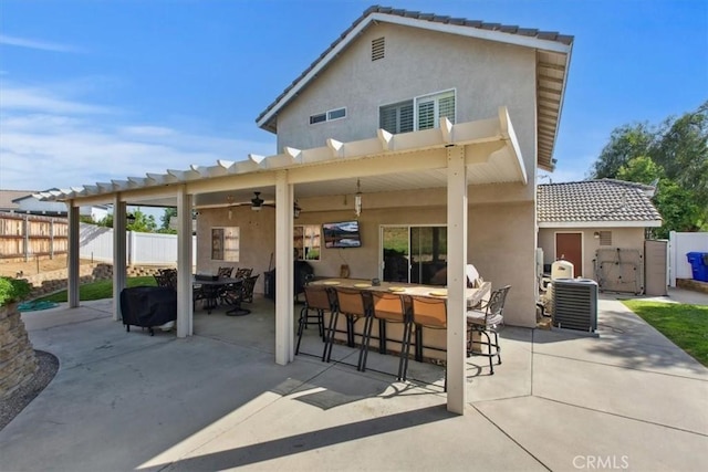 12427 Stardell Ln, Yucaipa, CA 92399 - rear view of house featuring fence, stucco siding, central AC, ceiling fan, and a patio