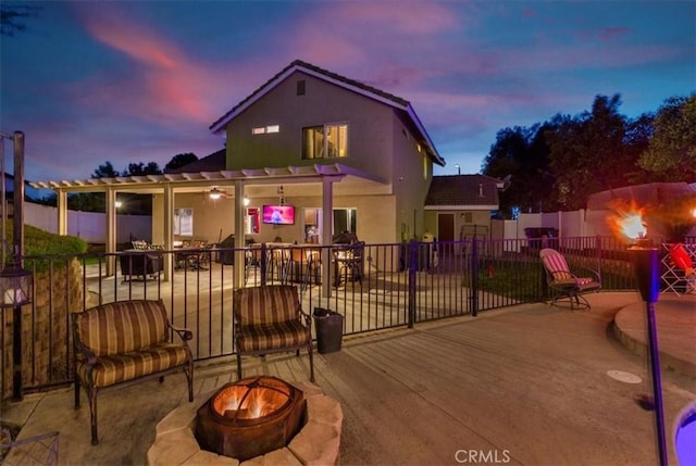 12427 Stardell Ln, Yucaipa, CA 92399 - exterior space with an outdoor fire pit, a patio area, a pergola, fence, and stucco siding