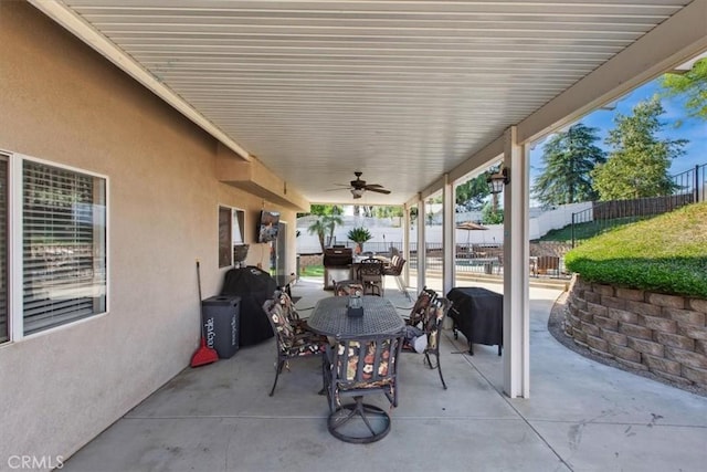 12427 Stardell Ln, Yucaipa, CA 92399 - view of patio featuring outdoor dining space, a ceiling fan, and a fenced backyard