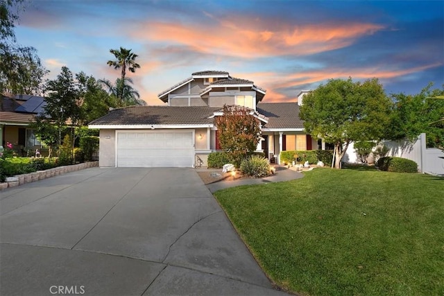 12427 Stardell Ln, Yucaipa, CA 92399 - view of front of house featuring driveway, stucco siding, a garage, and a tiled roof