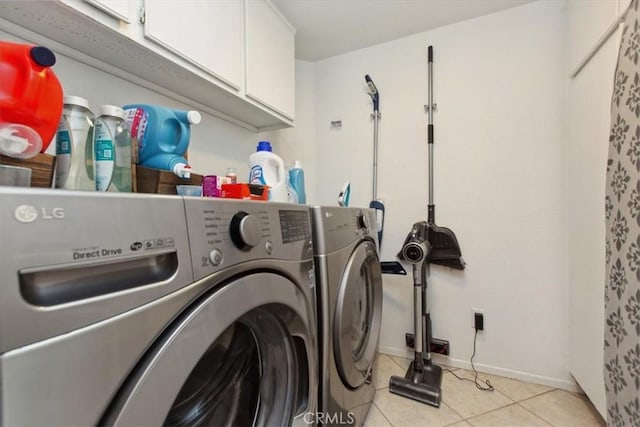 12427 Stardell Ln, Yucaipa, CA 92399 - clothes washing area featuring cabinet space, washer and dryer, light tile patterned floors, and baseboards