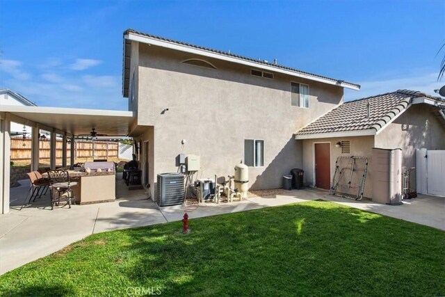 12427 Stardell Ln, Yucaipa, CA 92399 - rear view of property featuring ceiling fan, a patio, stucco siding, and cooling unit