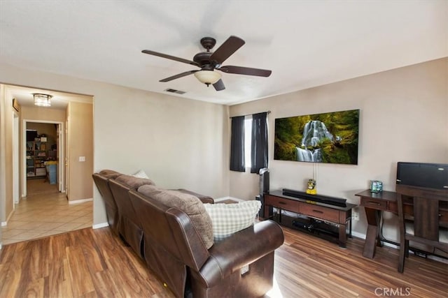 12427 Stardell Ln, Yucaipa, CA 92399 - tiled living area with ceiling fan and baseboards