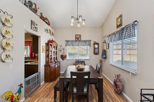 12427 Stardell Ln, Yucaipa, CA 92399 - dining area with light wood-style floors, a chandelier, and plenty of natural light