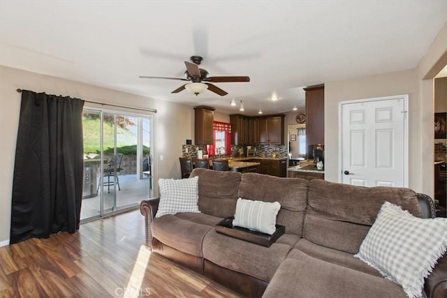 12427 Stardell Ln, Yucaipa, CA 92399 - living area with wood finished floors, ceiling fan, and baseboards