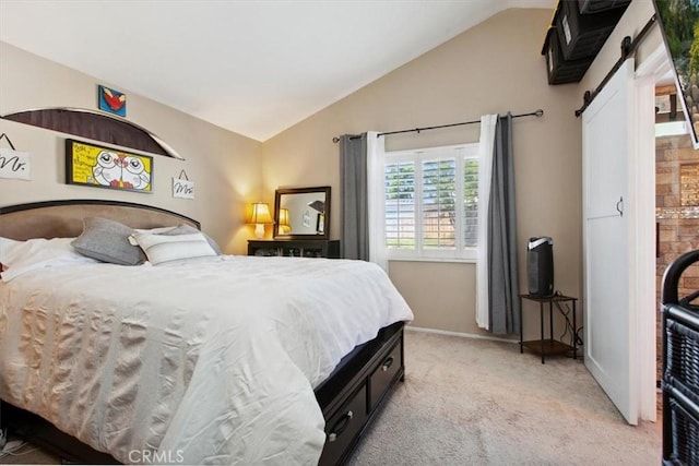 12427 Stardell Ln, Yucaipa, CA 92399 - bedroom featuring a barn door, lofted ceiling, carpet floors, and baseboards