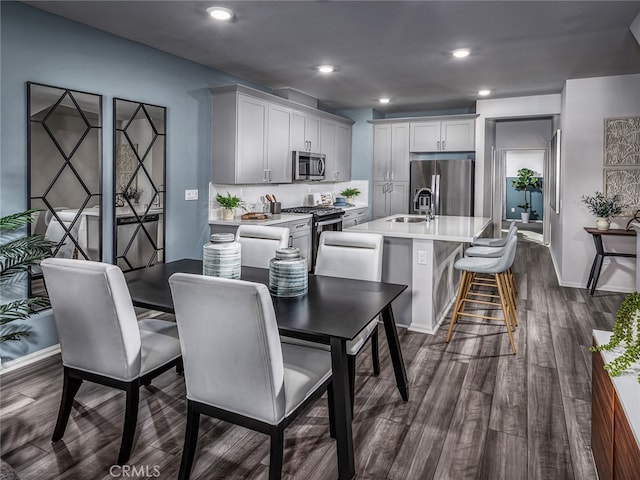 1543 Stratus Dr, Pomona, CA 91768 - dining room featuring baseboards, dark wood-type flooring, and recessed lighting