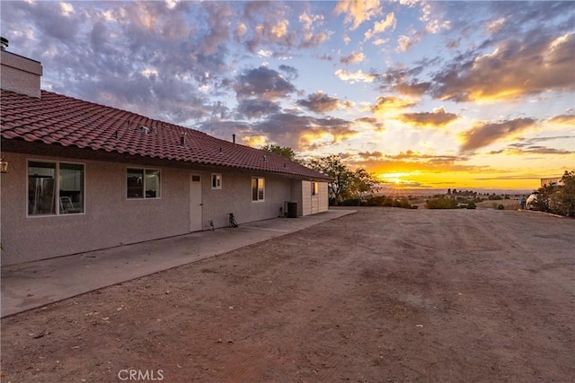 2245 Rancho Lomas Way, San Miguel, CA 93451 - view of side of home featuring stucco siding, cooling unit, and a tiled roof
