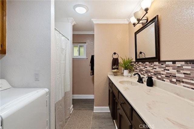 2245 Rancho Lomas Way, San Miguel, CA 93451 - full bathroom featuring washer / dryer, crown molding, wood finished floors, decorative backsplash, and vanity
