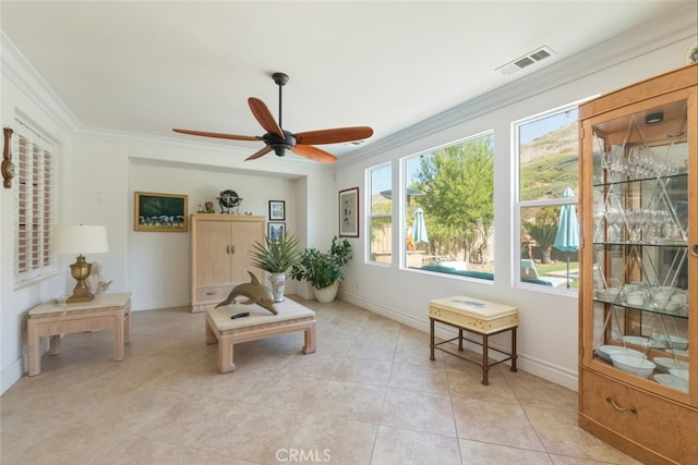34130 Camelina St, Lake Elsinore, CA 92532 - living area featuring crown molding, ceiling fan, baseboards, and light tile patterned floors