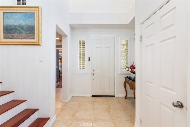 34130 Camelina St, Lake Elsinore, CA 92532 - foyer entrance with baseboards, light tile patterned floors, and stairway