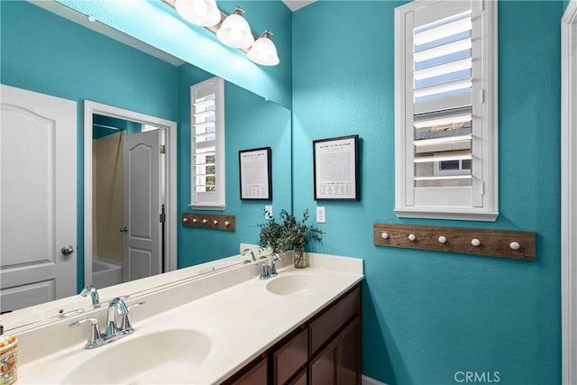 1689 Hometown Ln, Manteca, CA 95337 - bathroom featuring double vanity and washtub / shower combination
