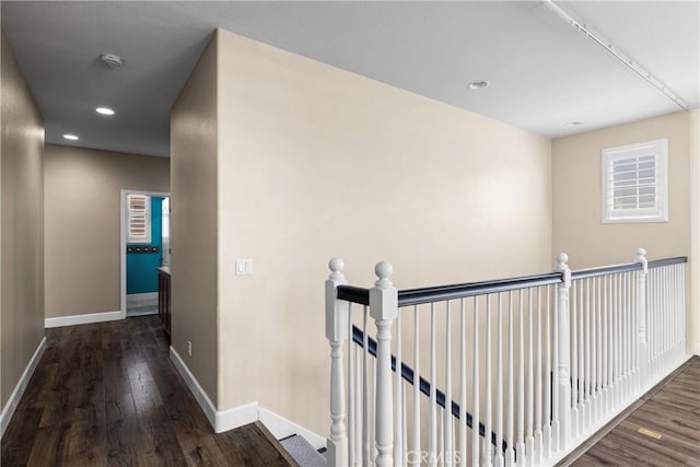 1689 Hometown Ln, Manteca, CA 95337 - hall featuring an upstairs landing, baseboards, dark wood finished floors, and recessed lighting